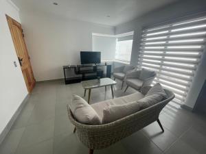 a living room with a couch and a table at Casa condominio costa del Sol a 1.4 km de Bahía Inglesa in Caldera