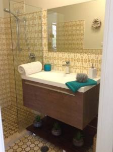 a bathroom with a sink and a shower at Seascape in Forster