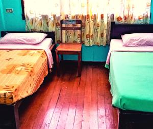 Sagada Guesthouse tesisinde bir odada yatak veya yataklar