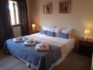 Posteľ alebo postele v izbe v ubytovaní Thiamis Guesthouse