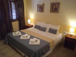 Posteľ alebo postele v izbe v ubytovaní Thiamis Guesthouse