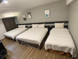 Letto o letti in una camera di Bonjour Hotel