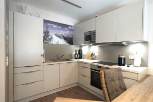 A kitchen or kitchenette at Wohnung 11 im Palais am Meer II