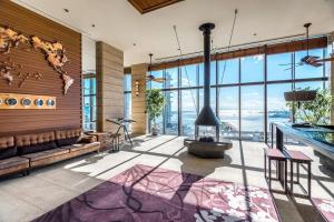 a living room with a large glass wall at ORIENTAL HOTEL in Kobe