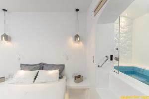 Posteľ alebo postele v izbe v ubytovaní Aphrodite Luxury Apartments