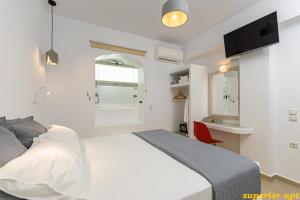Posteľ alebo postele v izbe v ubytovaní Aphrodite Luxury Apartments
