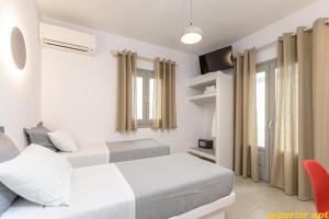 Posteľ alebo postele v izbe v ubytovaní Aphrodite Luxury Apartments