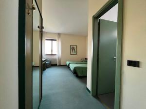 Säng eller sängar i ett rum på Hotel La Goletta
