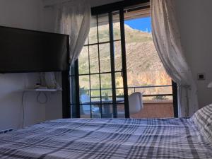 Postel nebo postele na pokoji v ubytování Altea Mascarat playa
