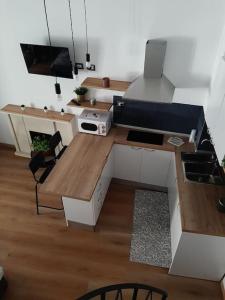 a small kitchen with a table and a couch at Casetta San Giorgio in Vallata