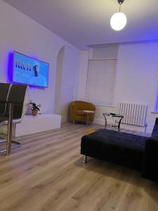 Telewizja i/lub zestaw kina domowego w obiekcie Modern 2bedrooms in woolwich