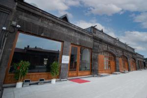 a building with a large window on the side of it at AHISKA PALAS OTEL in Kars