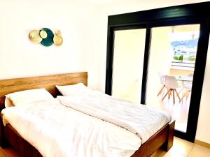 Posteľ alebo postele v izbe v ubytovaní Cirene Albir