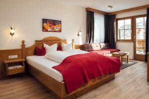 Postel nebo postele na pokoji v ubytování Hotel Garni am Sonnberg