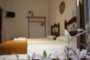 Postel nebo postele na pokoji v ubytování La Piquera Hostal