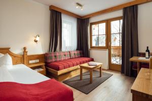 Postel nebo postele na pokoji v ubytování Hotel Garni am Sonnberg