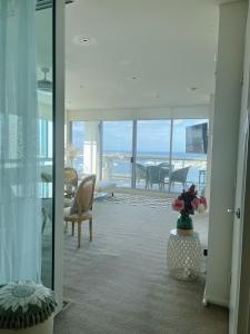 a living room with a view of the ocean at Stunning view close to everything in Gold Coast