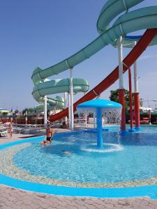 a boy in a water slide at a water park at Hotel Monti in Riccione