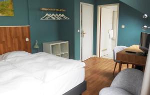 Ein Bett oder Betten in einem Zimmer der Unterkunft Hotel Liegeplatz 13 Kiel by Premiere Classe