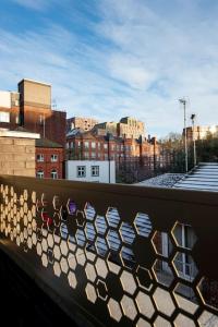 a view of a city from a balcony at Free Parking - Roof Terrace - Luxury Townhouse in Manchester