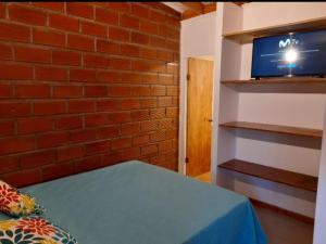 En eller flere senge i et værelse på Arriendo mini departamento en Coquimbo