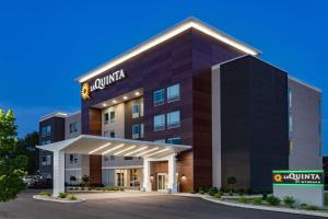 a rendering of the front of a hotel at La Quinta Inn & Suites by Wyndham South Bend near Notre Dame in South Bend