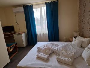 מיטה או מיטות בחדר ב-Motel LAGUNA