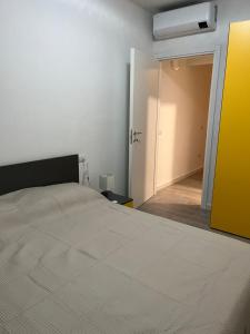 a bedroom with a bed and an open door at Owen Home Holiday in Castelsardo +46 photos