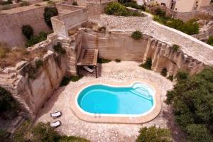 an aerial view of a swimming pool in a yard at Esperanto Suite&Pool - Nuova Gestione 2026 in Favignana +26 photos