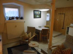a kitchen and dining room with a table and chairs at Apartment Regina in Laucha