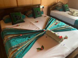 A bed or beds in a room at Sigiriya Paradise Treehouse