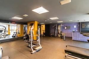 a gym with treadmills and machines in a room at Flat Particular Hotel Kubitschek in Brasilia