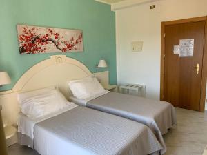 Postel nebo postele na pokoji v ubytování Hotel La Margherita & SPA