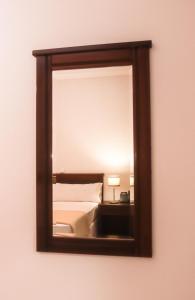 Cama ou camas em um quarto em Hotel Central Santa Maria