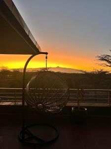 a view of a sunset from a balcony at Nyikani Villa Olpejeta in Nanyuki