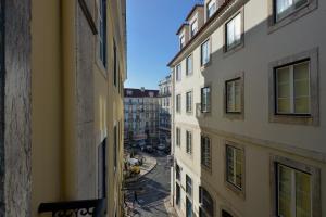 a view of an alley between two buildings at FLH Bairro Alto - Chiado Spacious Flat in Lisbon