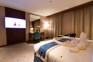 Postel nebo postele na pokoji v ubytování Najm aris hotel