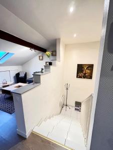 Televízia a/alebo spoločenská miestnosť v ubytovaní Pin's - Magnifique appartement