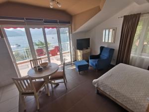 Ένα ή περισσότερα κρεβάτια σε δωμάτιο στο Apartments Villa PM