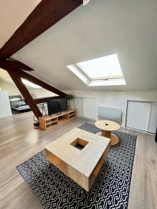 Televízia a/alebo spoločenská miestnosť v ubytovaní Pin's - Magnifique appartement