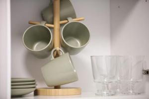 a shelf with bowls and glasses on a table at Sunlight Studio in King's Cross in London