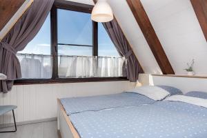 Ένα ή περισσότερα κρεβάτια σε δωμάτιο στο Ferienhaus Küstenkind - Top Lage - Garten eingezäunt