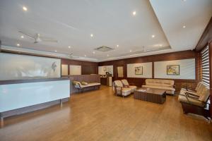 a large living room with a large flat screen tv at Nettoor Pavilion in kumbalam