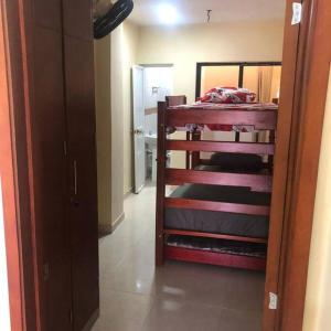 a hallway with a room with a bunk bed in a room at Apartamento para 5 in Barranquilla