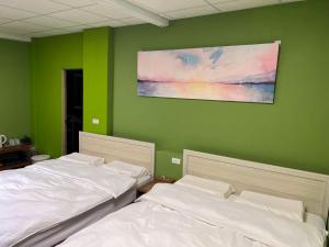 Postel nebo postele na pokoji v ubytování 自然海naturalhigh