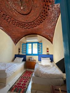 Ένα ή περισσότερα κρεβάτια σε δωμάτιο στο Lake House by Tunisia Green Resort +47 φωτογραφίες