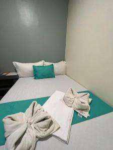Postel nebo postele na pokoji v ubytování Laule'a Hostel