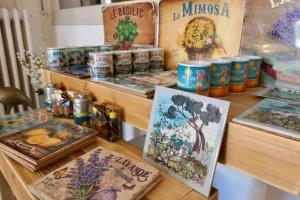 a wooden counter with some paintings on it at Motel Cap Sol in Mandelieu-la-Napoule