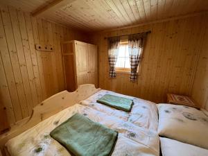 Voodi või voodid majutusasutuse Kilge Alm toas