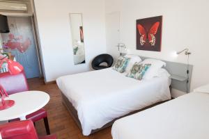 Postel nebo postele na pokoji v ubytování Motel Cap Sol
